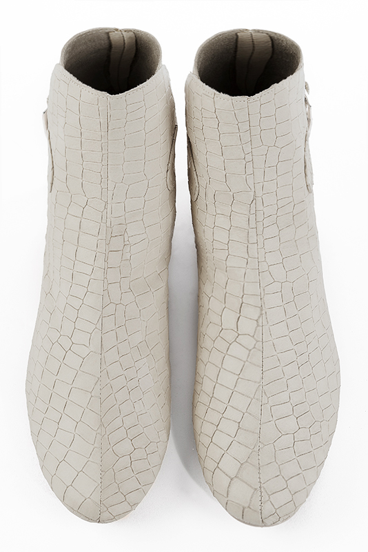 Off white women's ankle boots with buckles at the back. Round toe. Flat block heels. Top view - Florence KOOIJMAN
